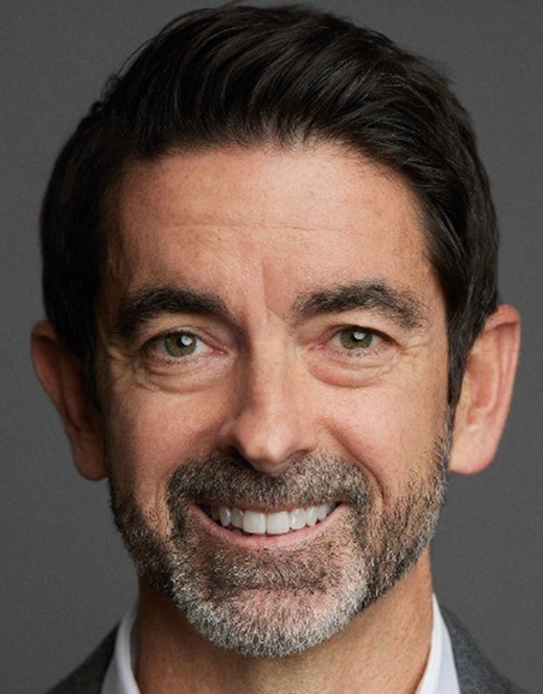 man smiles for the camera