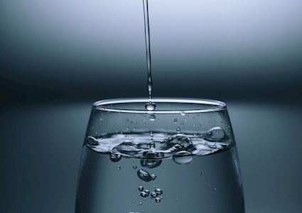 WATER GLASS BEING FILLED